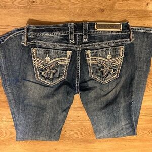 Rock Revival Blue Boot Cut Jeans with Ornate Back Design